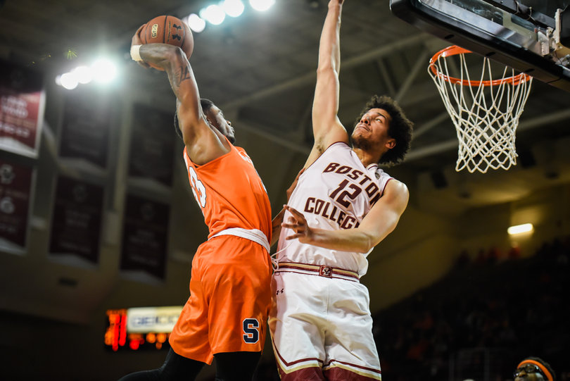 Frank Howard rises up to throw down a monster dunk, but his attempt would miss the mark.
