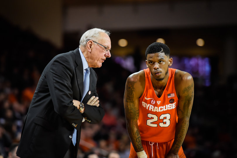 Syracuse head coach Jim Boeheim talks to Frank Howard during a stoppage.