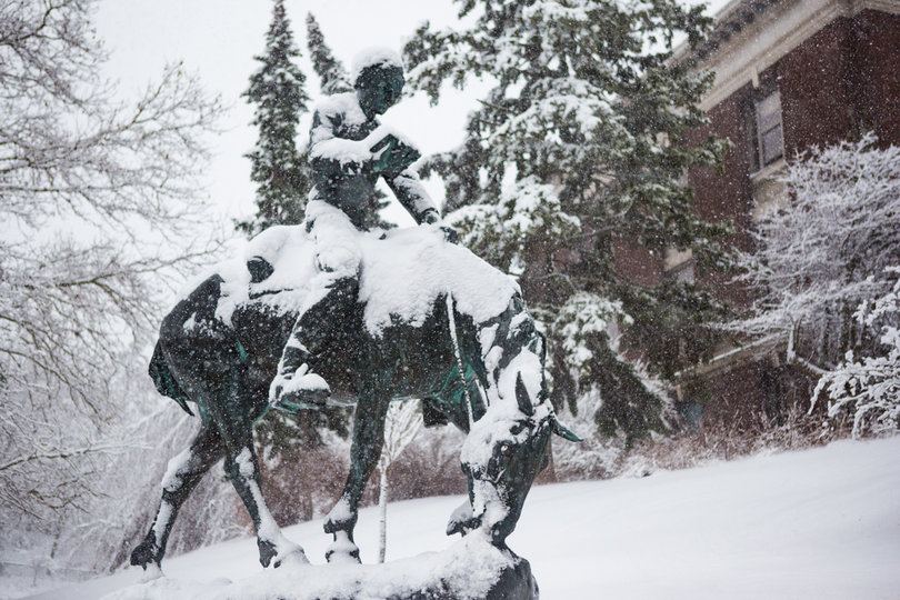A statue of Abraham Lincoln is covered in snow at one of the entrances to SUNY-ESF on Friday.