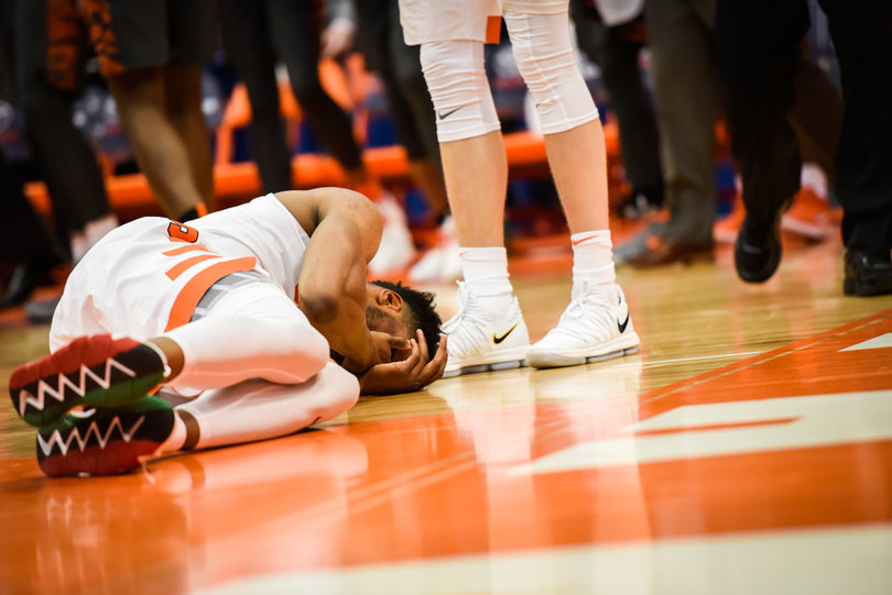 Brissett holds his face after being poked in the eye.