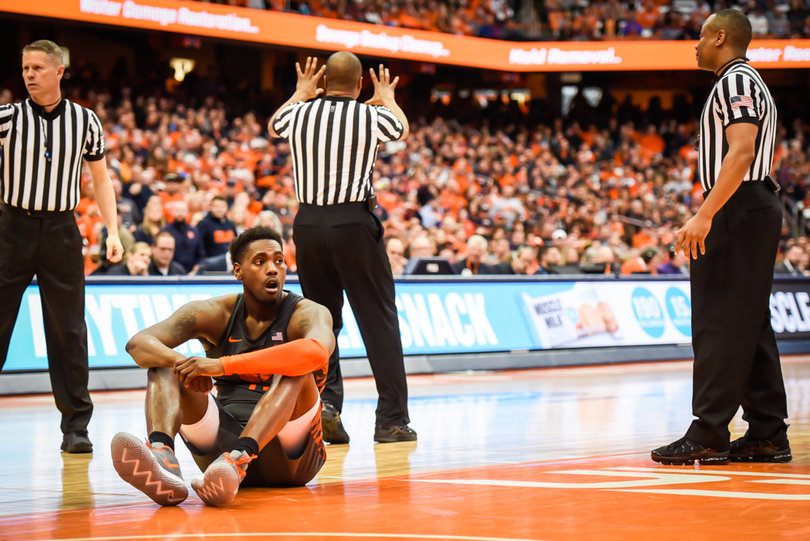 Elijah Thomas sits in frustration after he fouled Battle on an and-one. 