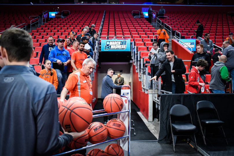 Fans await players and coaches for signatures at Thursday's practice.