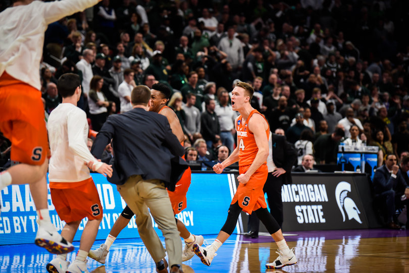 Bayer and the Orange celebrate the win as the final buzzer sounded. 