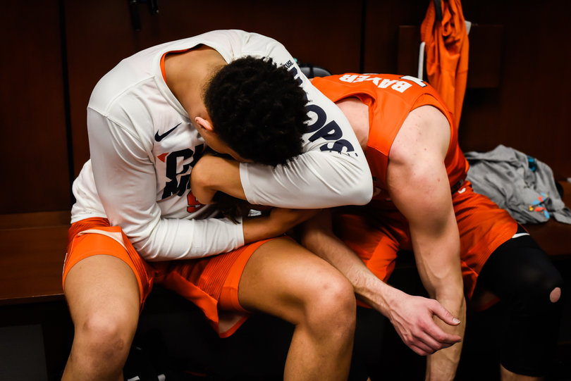 Moyer embraces Bayer outside their lockers. 