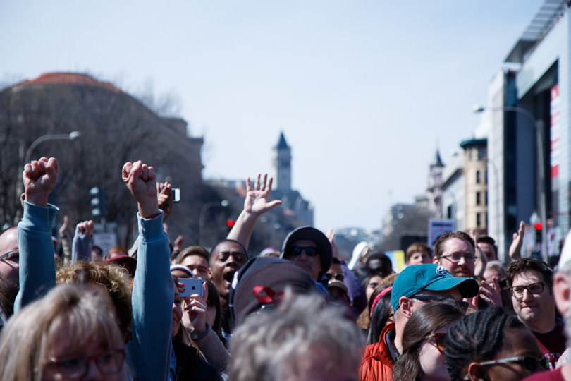 Protesters raised their fists, and signs, in the air throughout the rally, which lasted about three hours.