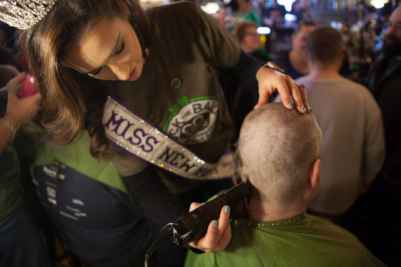 Lexi Kerr, Miss New York International, volunteered to help shave heads at the event.
