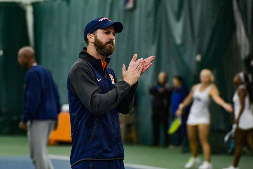 Syracuse volunteer assistant coach Len Lopoo cheers on his players in the upset win.