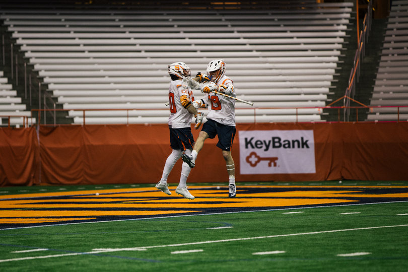 Syracuse players celebrate one of their 11 goals. 