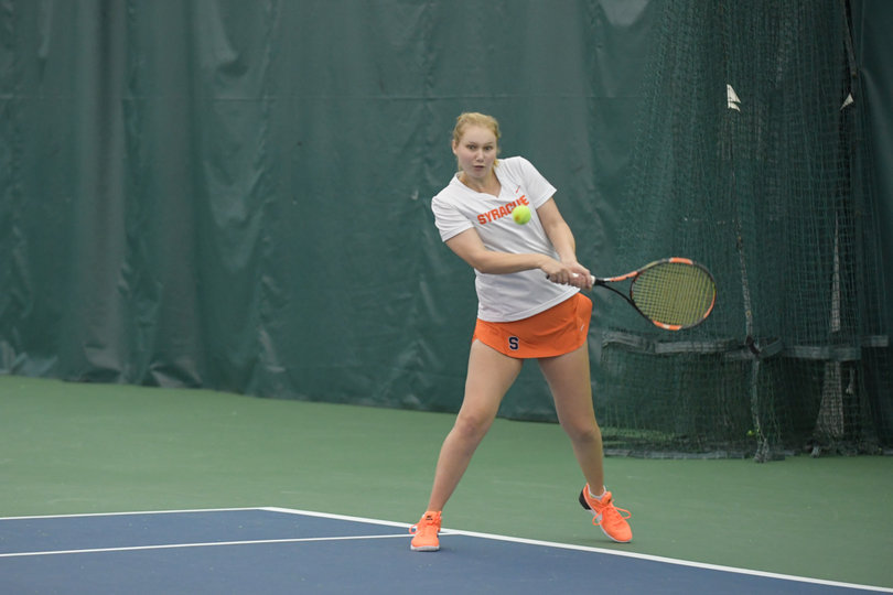 Nicole Mitchell warms up prior to Friday's match. She'll celebrate Senior Day on Sunday.