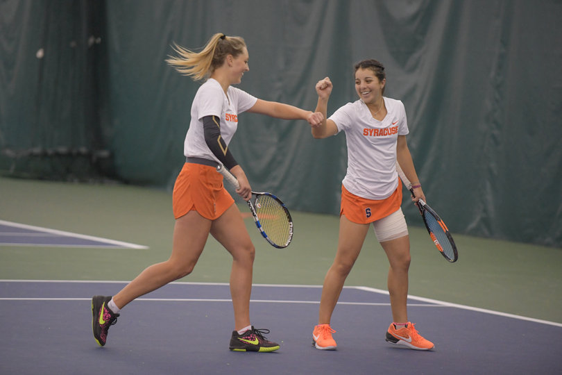 Ramirez and Knutson celebrate a point won in their first doubles match.