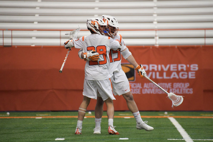 Syracuse celebrates one of its 13 goals. 