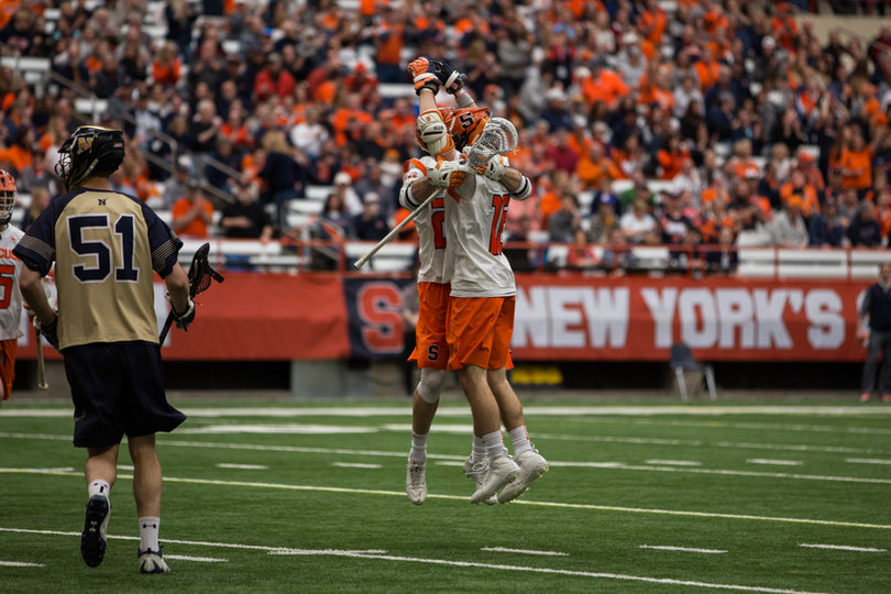 Syracuse celebrates one of its 12 goals. 