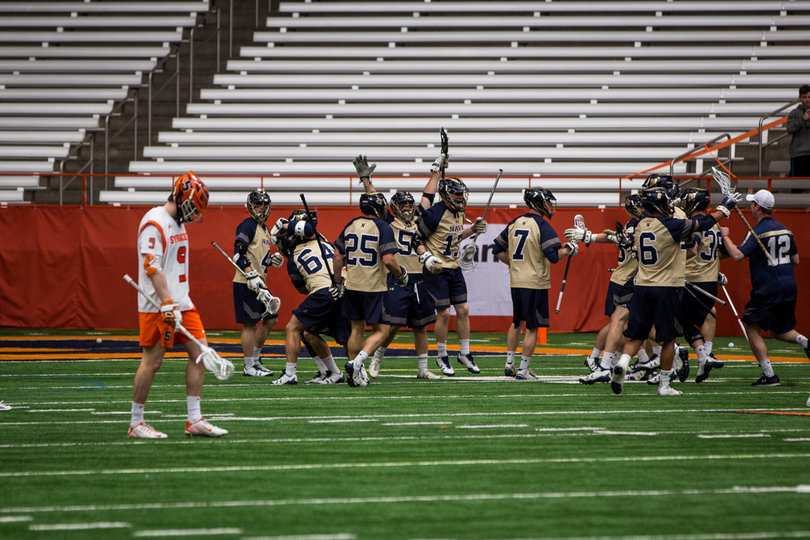 Navy celebrates the Joe Varello goal. 