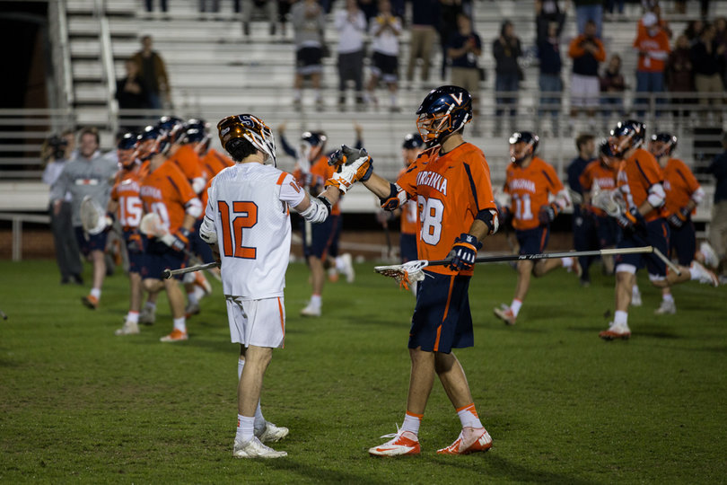 Trimboli shakes hands with a Virginia player after Syracuse falls in the ACC tournament semifinals.