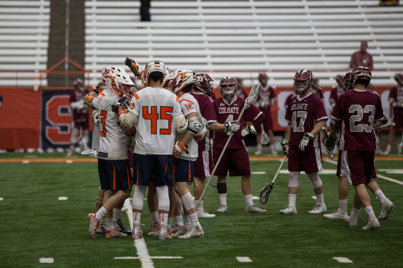 Syracuse players huddle.