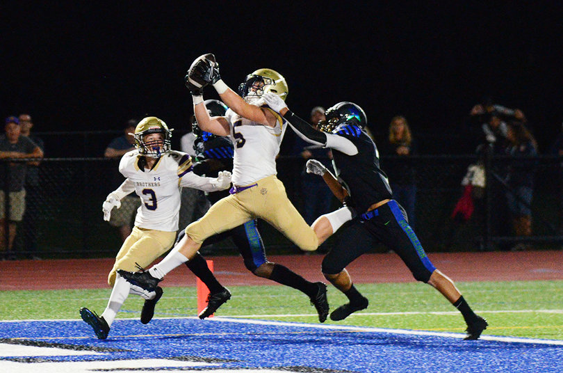 Jack Szatkowski hauls in a 24-yard pass for a touchdown in the second quarter for CBA.
