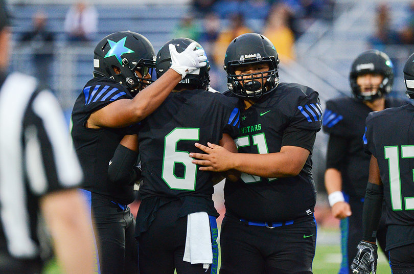 C-NS players congratulate Mcgriff after one of his long runs on a day he ran for 139 yards.