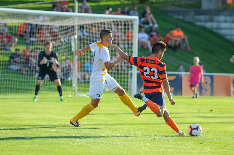 Ryan Roposso kicks the ball in towards the net. He recorded an assist on SU's opening goal.