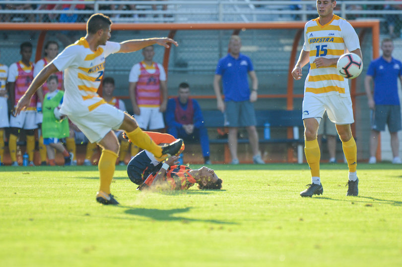 Tajon Buchanan hits the pitch in the first half after being taken down by a slide.