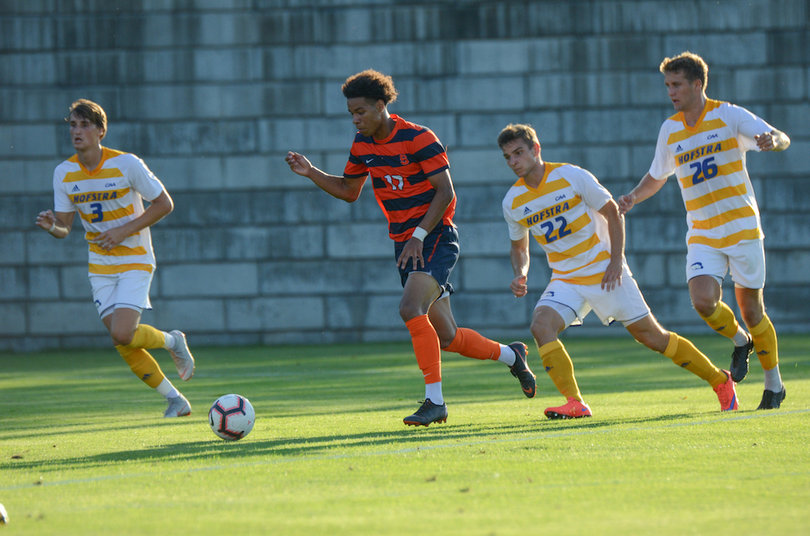 Buchanan weaves by Hofstra defenders.