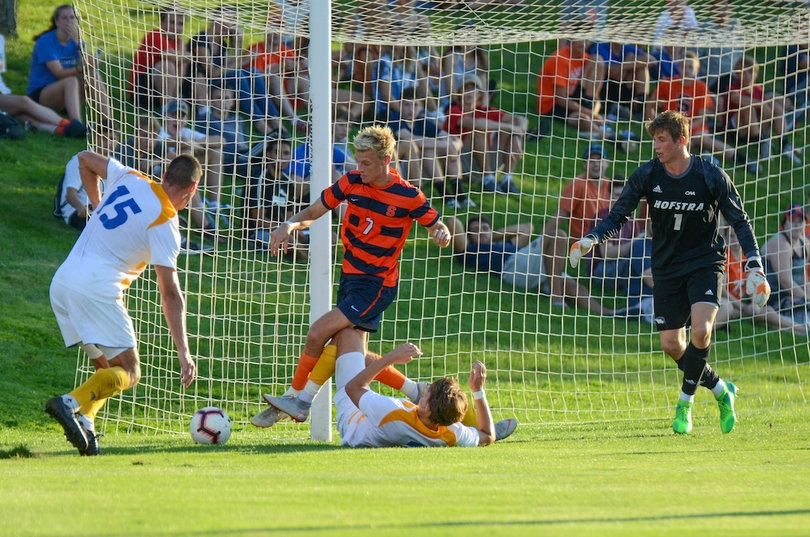Soerlie makes a play on a ball by the net.