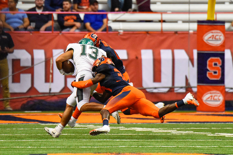 Eric Coley makes a tackle for the Orange. He had three tackles in the game.