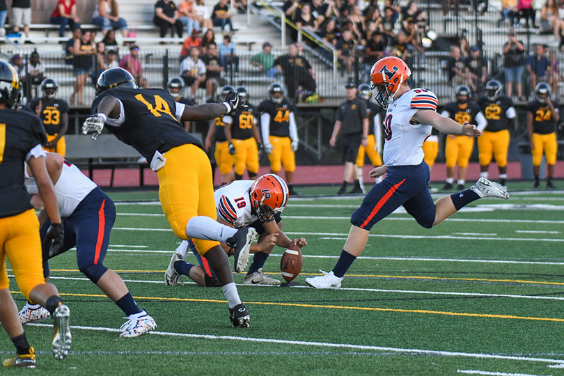 Ryan Metzler knocks in an extra point for Liverpool.