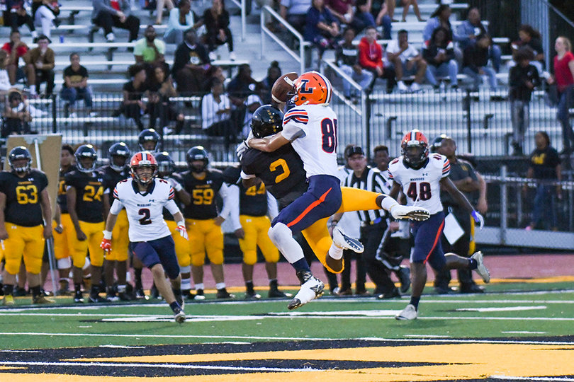 Somehow, Joseph Valerino (No. 80) came down with this ball for his second interception of Doughty.