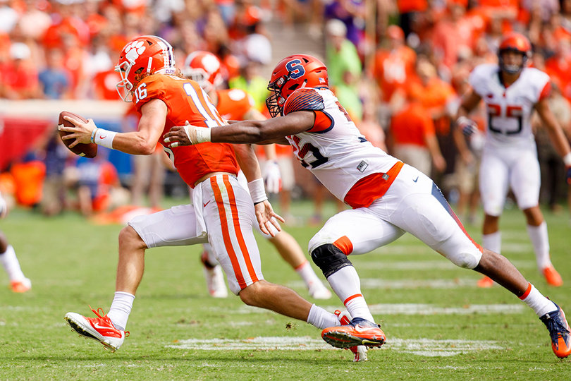 Kendall Coleman puts pressure on Clemson quarterback Trevor Lawrence.