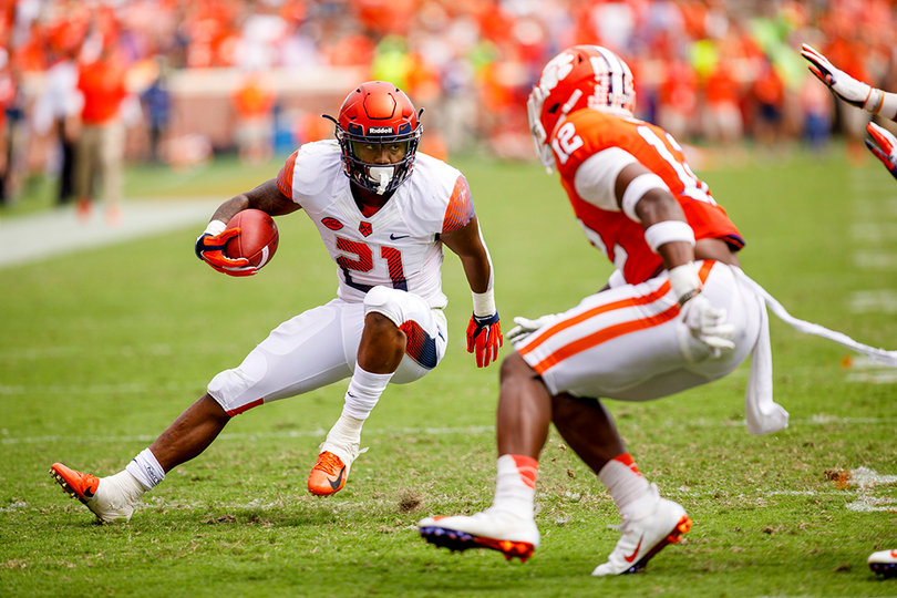Moe Neal makes a cut against a Clemson safety.