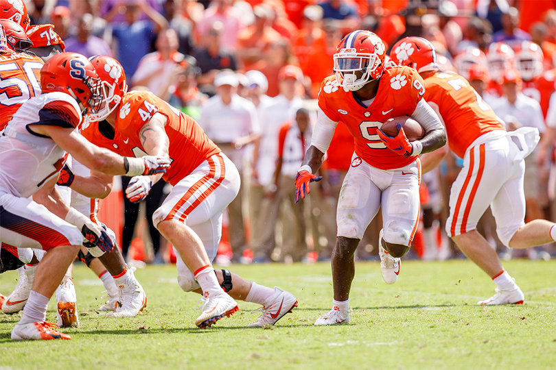 Etienne rushes the ball.