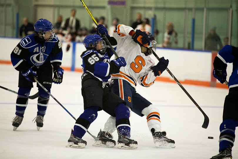 A Carabin player battles with the Orange for puck possession. 