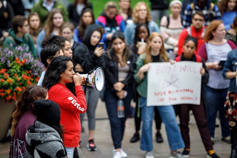 Senior geography major Janet Flores speaks about the intersection of women's oppression and indigenous people at the demonstration.