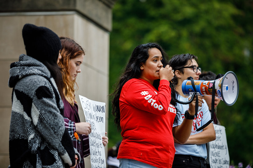 Protesters Crystal Letona, Abby Henry, Janet Flores and Clark Bermudez address the crowd on issues of sexual violence.