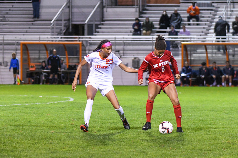 Brown side-shuffles to stick with an NC State player.