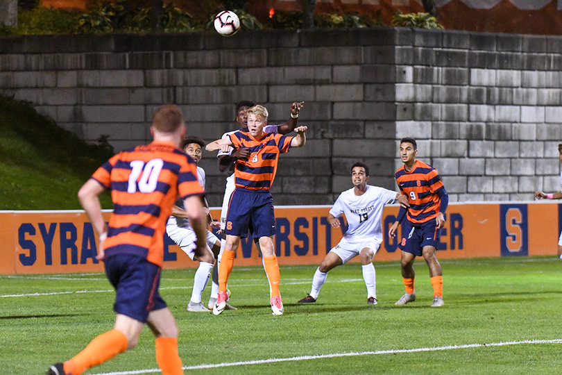Jonathan Hagman readies to head the ball. He took a shot against the Demon Deacons.