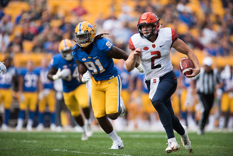 Syracuse Orange quarterback Eric Dungey (2) makes a run as Pittsburgh Panthers defensive lineman Patrick Jones II (91) follows.