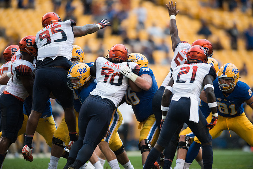Syracuse attempts to block one of Pittsburgh's three field goal attempts. 