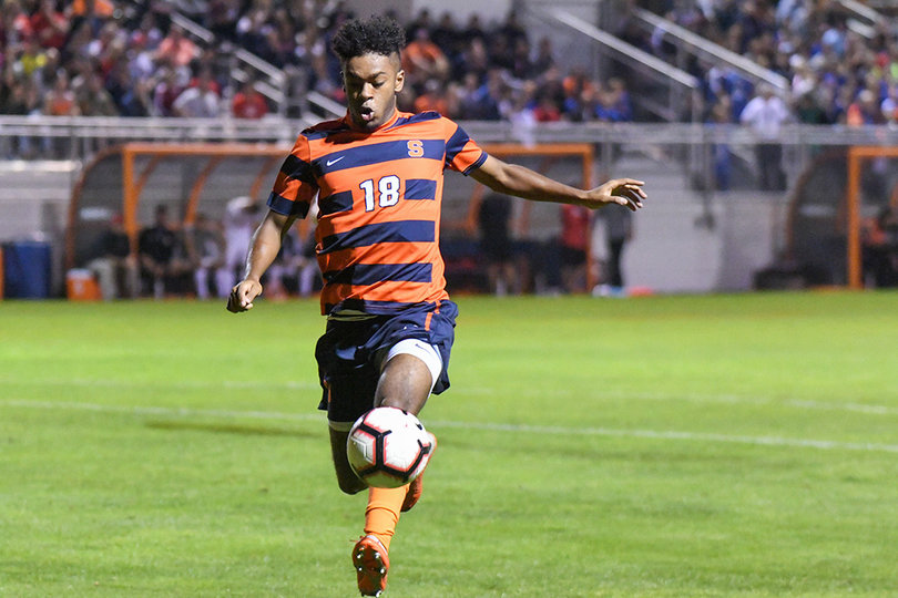 Julio Fulcar juggles the ball by his feet.