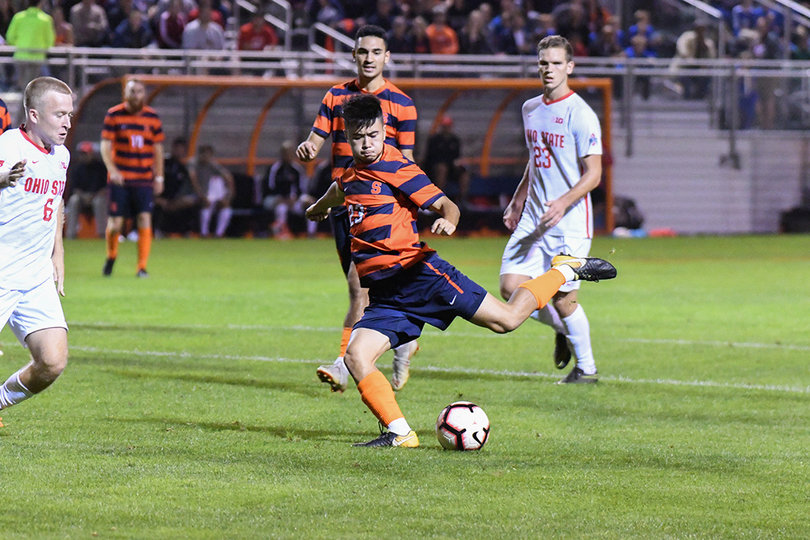 Ryan Raposo takes a swing at the ball with his foot.
