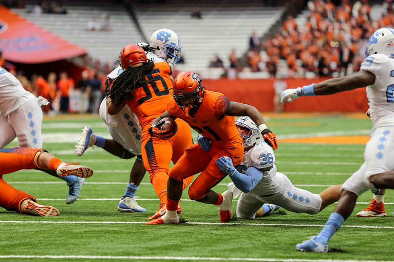 Moe Neal gets taken down from behind by a North Carolina defender. He had 66 yards on eight carries.