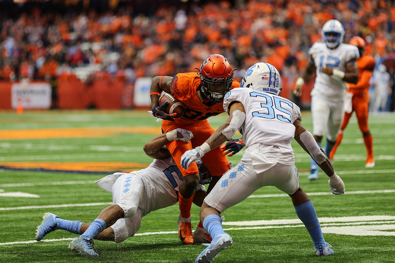 Taj Harris stutter-steps a North Carolina defender. He caught five passes for 51 yards.