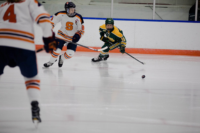 All eyes are on the puck as the Syracuse offense fights for a third goal. 