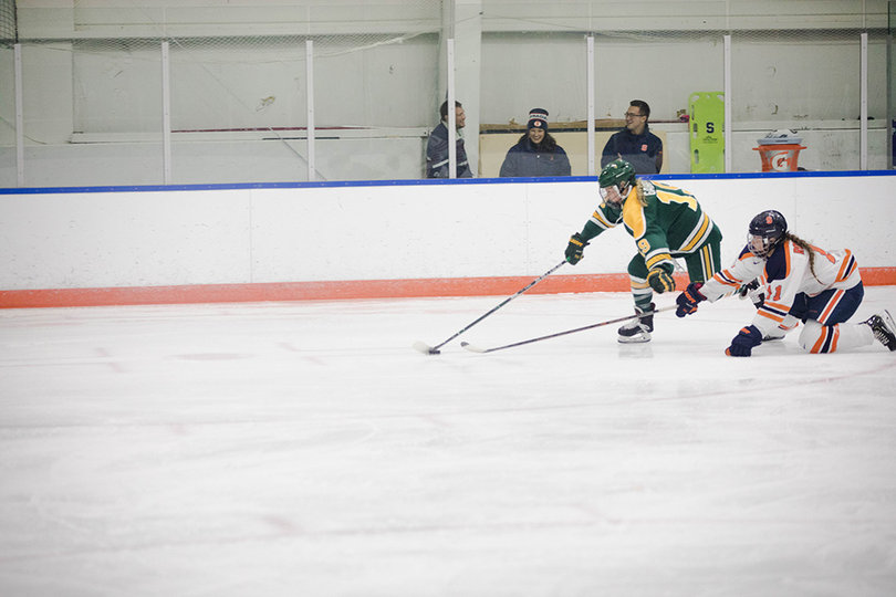 Kelli Rowswell steals the puck away from a Clarkson player. 