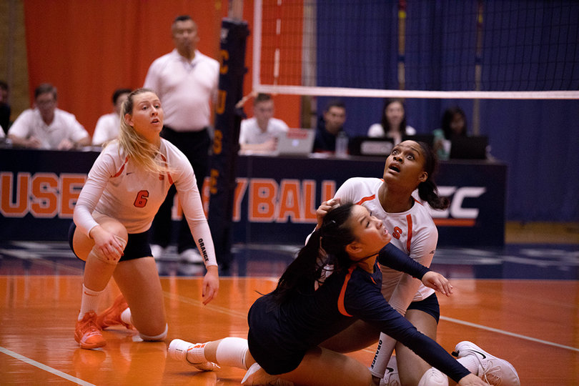 Syracuse watches the ball hit the court after a long rally, resulting in a Boston College point.