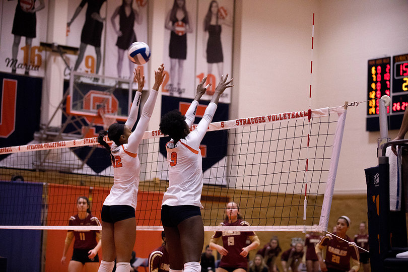 Boston College's shot sneaks through the hands of Christina Oyawale and Amber Witherspoon. 
