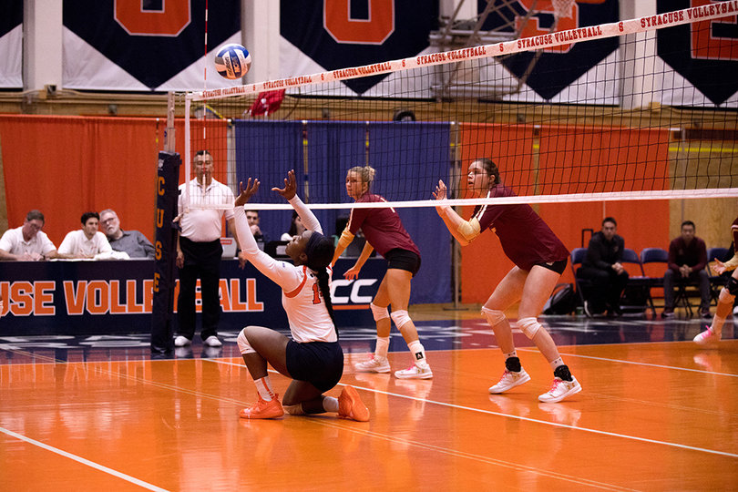 Jalisaa Trotter dives to keep a ball off the floor.