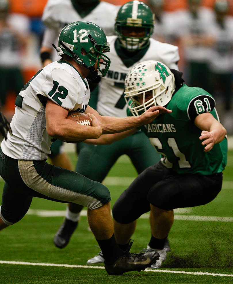 Holbrook runs through Herkimer defender Brendan Stoffolano. 
