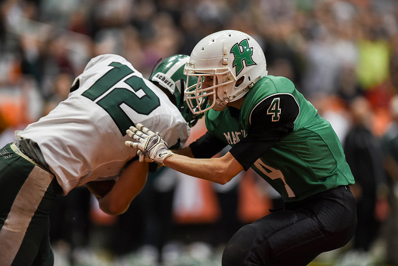 Herkimer's Santino Aceto tackles Holbrook in Friday's game. 