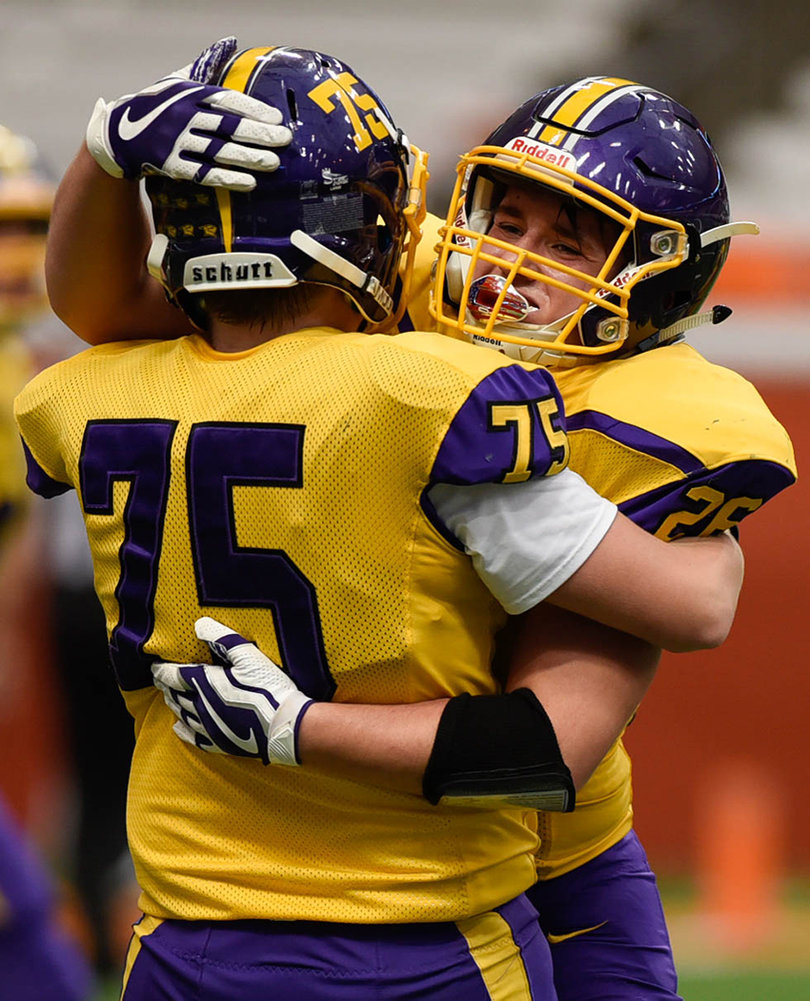 Brandon Cassidy (75), a senior, celebrates during the Holland Patent win.